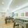 Foosball and pool tables with art on the walls
