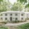 Apartment building exterior in the woods surrounded by trees
